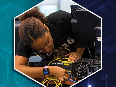 Female bending over a computer and attaching cables